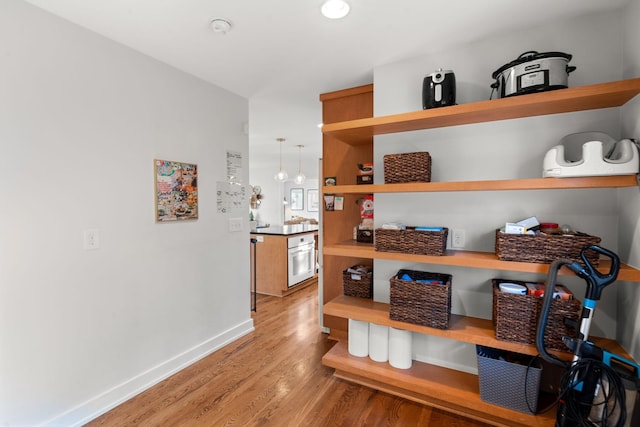 interior space with wood-type flooring and white oven