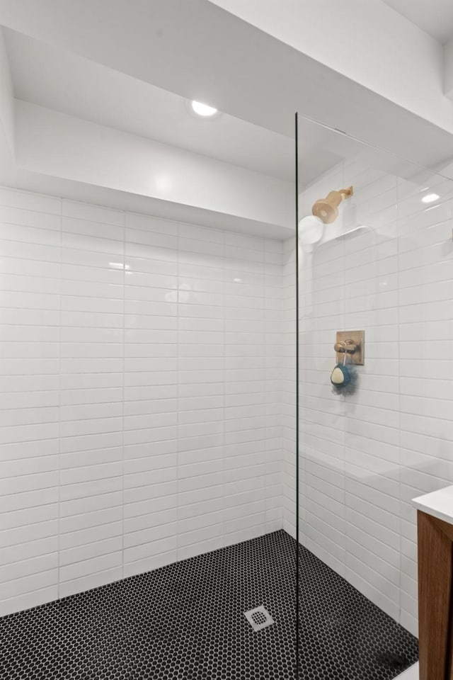 bathroom with vanity and a shower