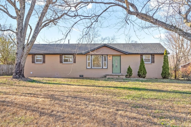 ranch-style home featuring a front yard