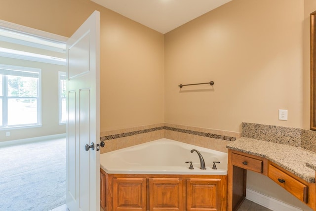 bathroom with vanity and a bathing tub