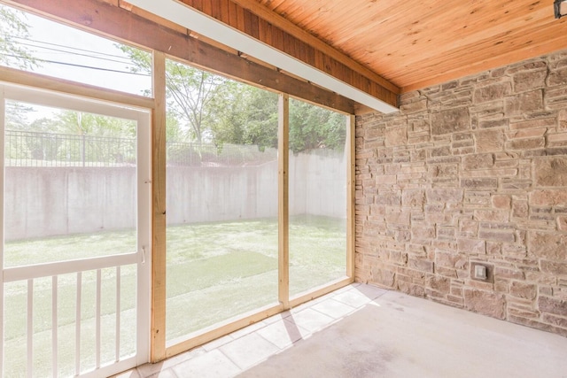 unfurnished sunroom featuring wooden ceiling