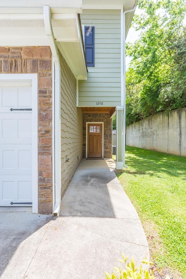 entrance to property with a yard