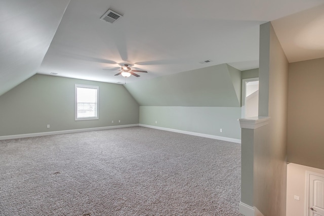 bonus room with carpet, vaulted ceiling, and ceiling fan