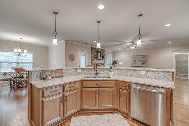 kitchen featuring dishwasher, ceiling fan with notable chandelier, hanging light fixtures, sink, and ornamental molding