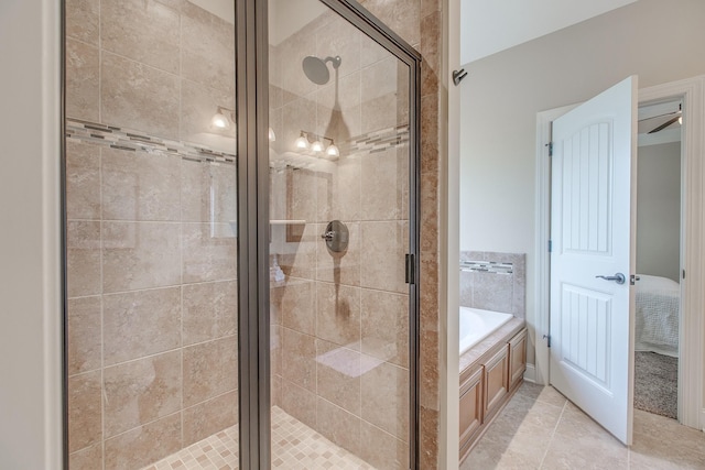 bathroom featuring tile patterned floors and independent shower and bath