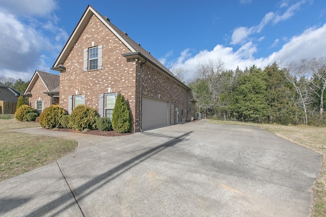 view of side of home with a garage