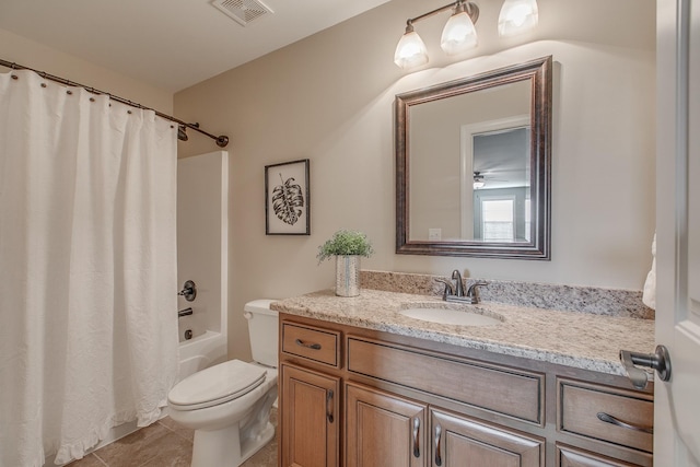 full bathroom with tile patterned flooring, vanity, shower / tub combo, and toilet