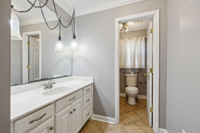 bathroom with tile patterned floors, toilet, vanity, and ornamental molding