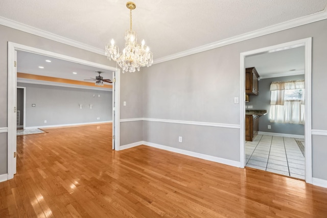 unfurnished room with light wood-type flooring, ceiling fan with notable chandelier, and ornamental molding