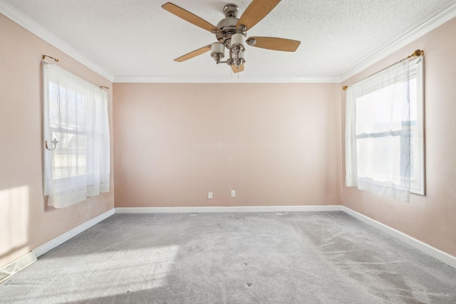 unfurnished room featuring light colored carpet, ceiling fan, and ornamental molding