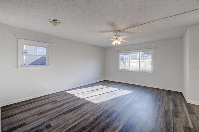 unfurnished room featuring ceiling fan, dark wood-type flooring, and a textured ceiling