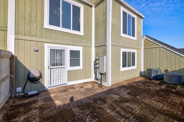 back of property featuring a patio and cooling unit