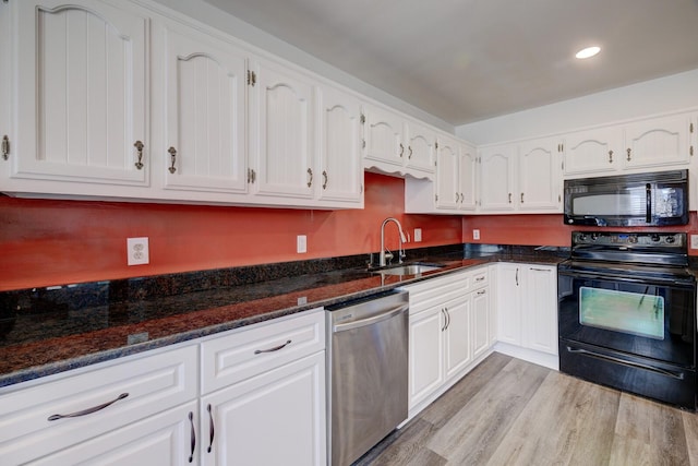 kitchen featuring black appliances, light hardwood / wood-style floors, white cabinets, and sink