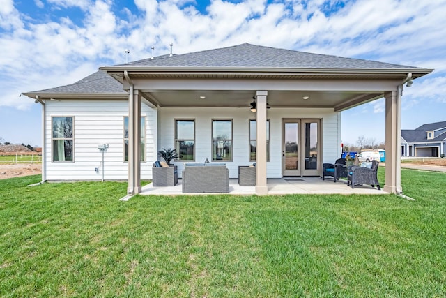 rear view of house with a lawn, an outdoor living space, ceiling fan, and a patio