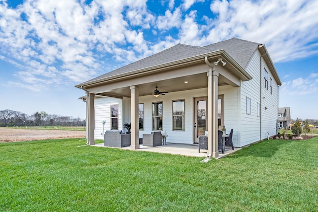 back of property with a patio, an outdoor hangout area, ceiling fan, and a lawn