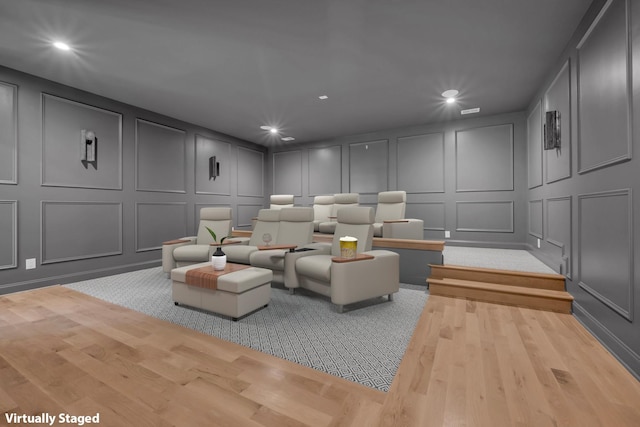 home theater room featuring light hardwood / wood-style floors