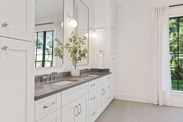 bathroom featuring tile patterned flooring, plenty of natural light, and vanity