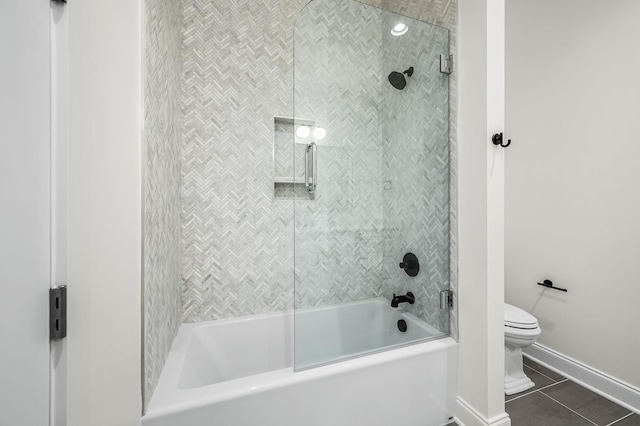 bathroom featuring tile patterned floors, toilet, and shower / bath combination