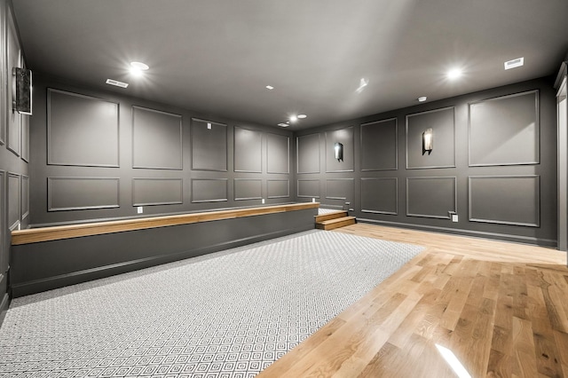 cinema room featuring light hardwood / wood-style flooring