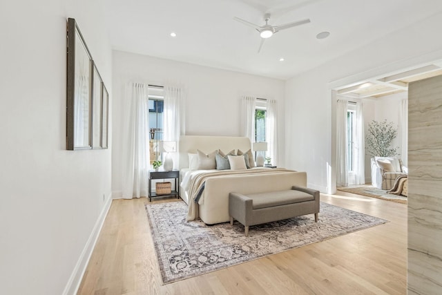 bedroom with ceiling fan and light hardwood / wood-style flooring