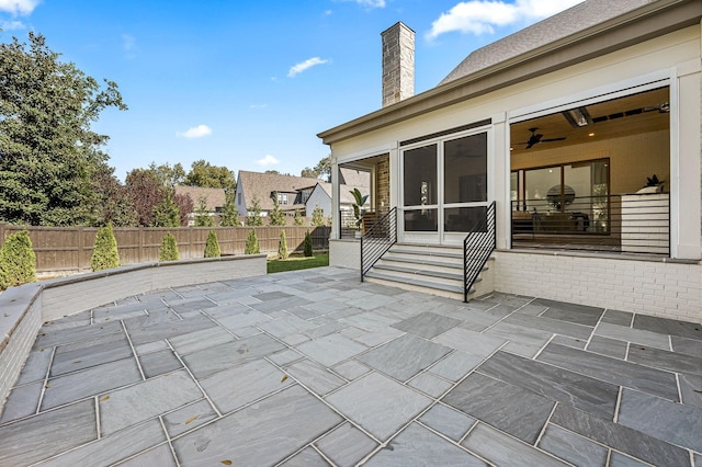 view of patio / terrace with a sunroom