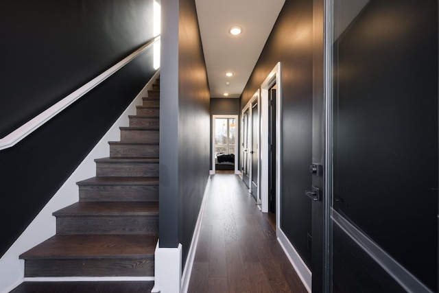 stairs with hardwood / wood-style flooring