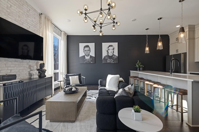 living room featuring a chandelier and hardwood / wood-style floors