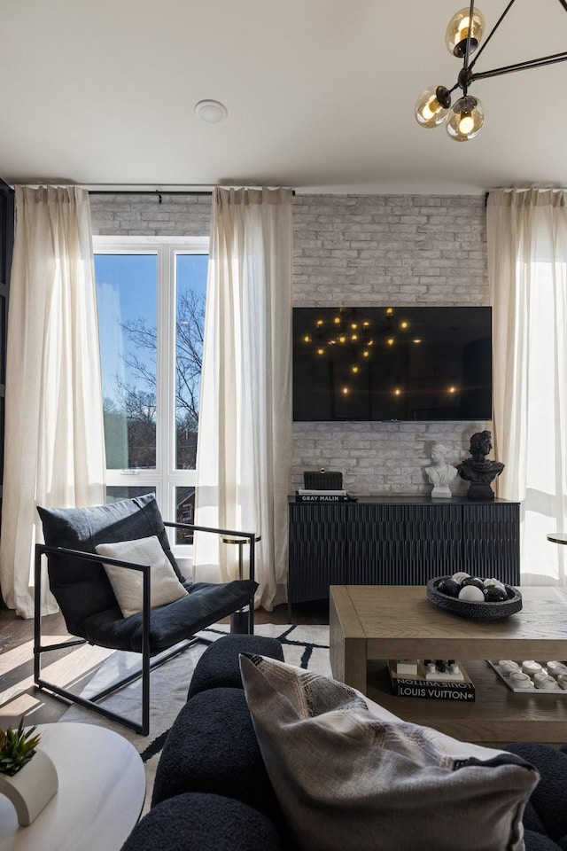 living room featuring plenty of natural light and an inviting chandelier