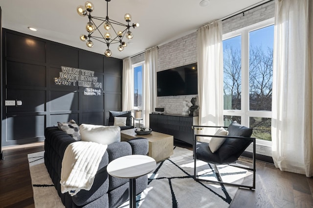 living room featuring hardwood / wood-style floors and a notable chandelier