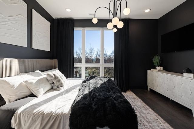 bedroom with dark wood-type flooring