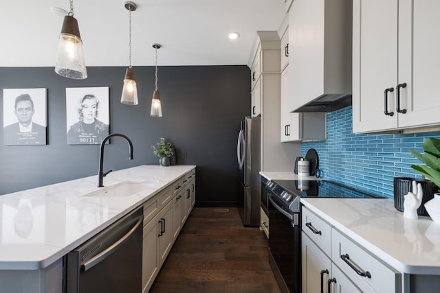 kitchen featuring black dishwasher, electric stove, pendant lighting, wall chimney exhaust hood, and sink