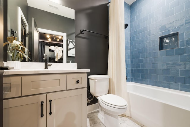 full bathroom featuring toilet, vanity, and shower / bath combo with shower curtain