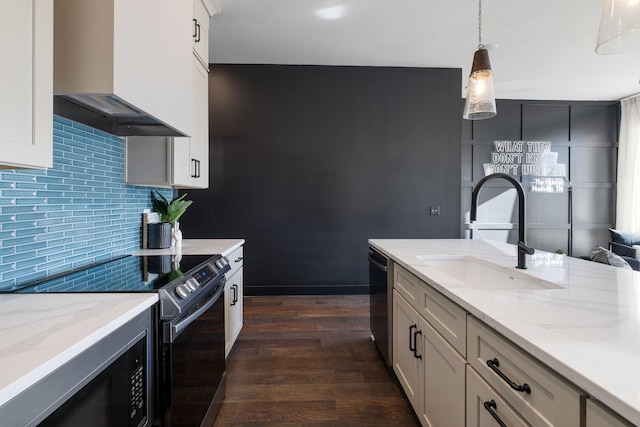 kitchen with decorative light fixtures, electric stove, custom exhaust hood, sink, and black dishwasher