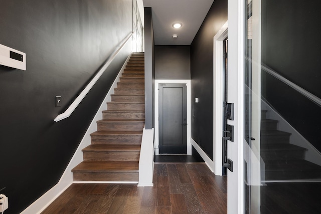 stairway featuring hardwood / wood-style flooring