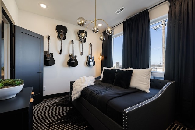 bedroom with an inviting chandelier