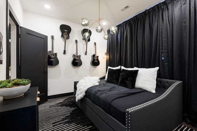 bedroom with sink and an inviting chandelier