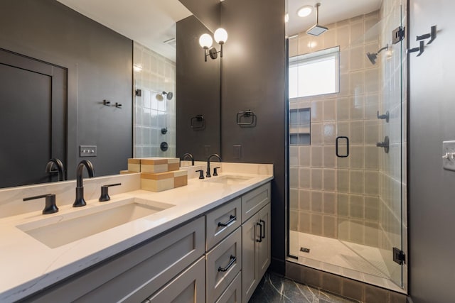 bathroom featuring vanity and a shower with door