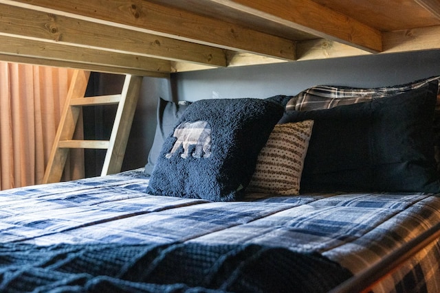 bedroom with beam ceiling