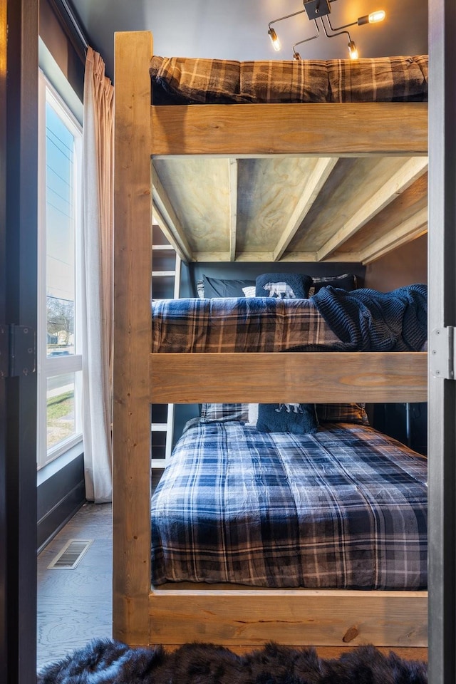 bedroom with wood-type flooring