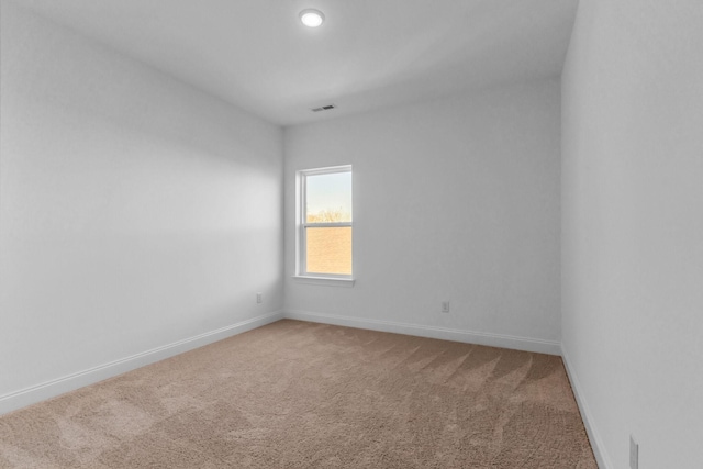 unfurnished room featuring carpet floors