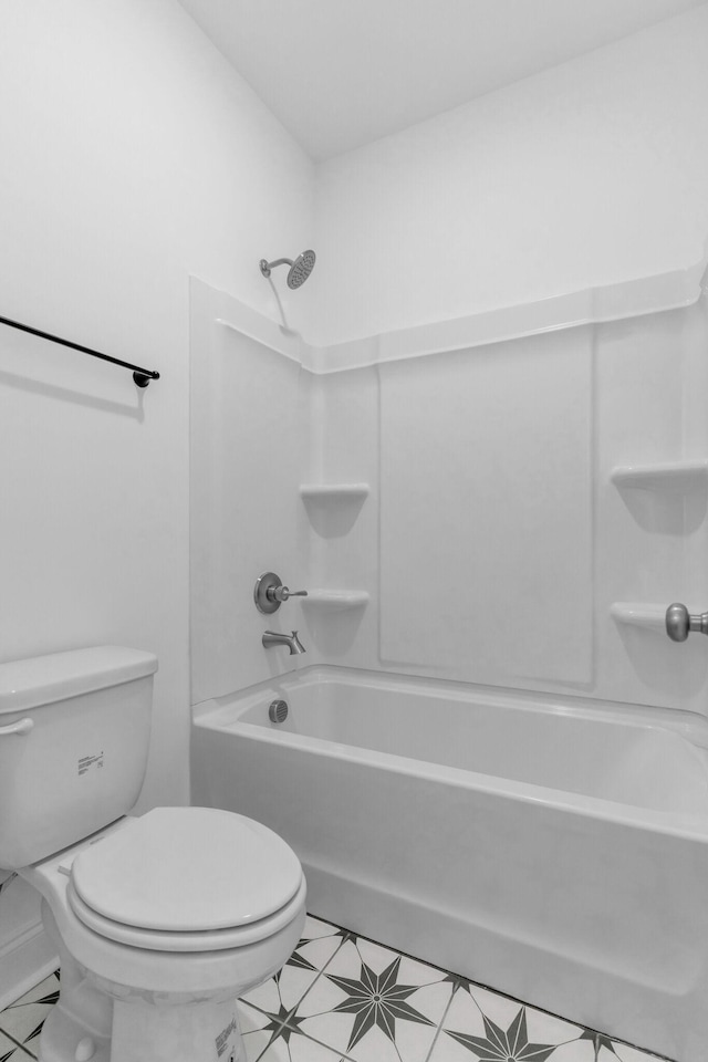 bathroom with toilet and shower / bathtub combination