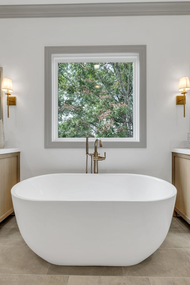 bathroom with vanity and a bath