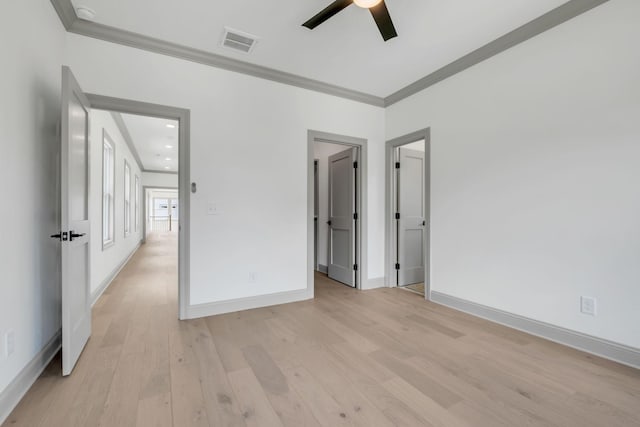 unfurnished bedroom with ceiling fan, light hardwood / wood-style floors, and crown molding