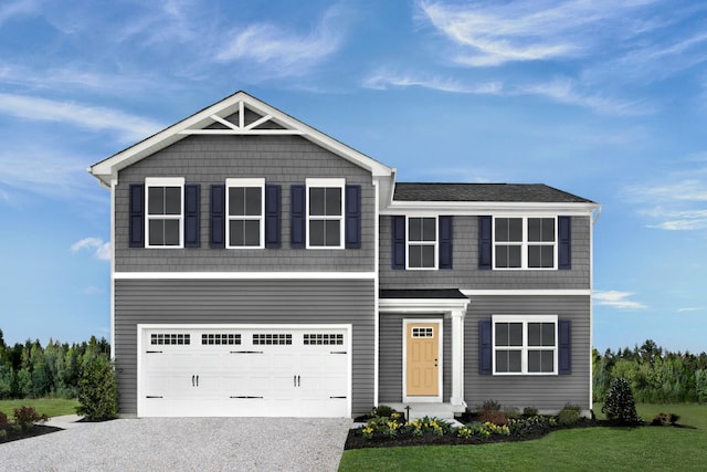 view of front facade with a garage and a front lawn