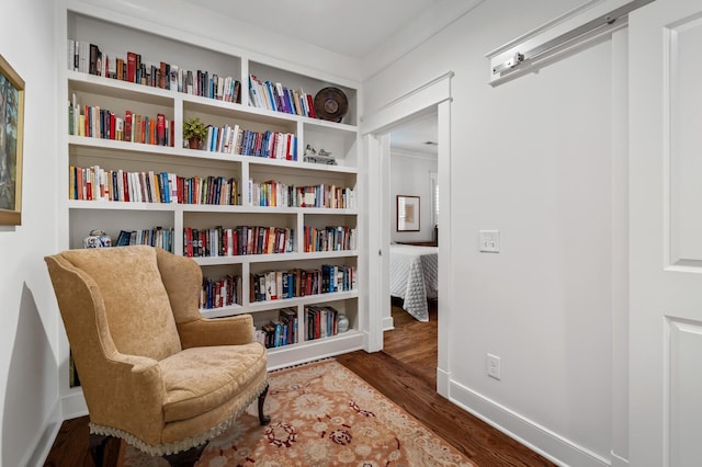 sitting room with dark hardwood / wood-style floors