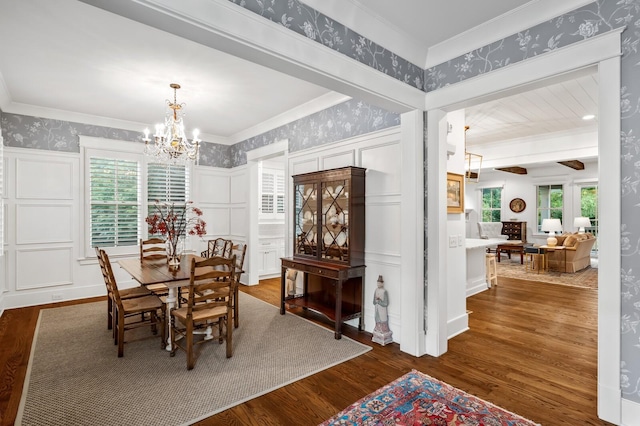 dining room featuring dark wood-type flooring and an inviting chandelier