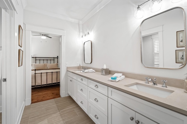 bathroom featuring vanity, ceiling fan, and ornamental molding