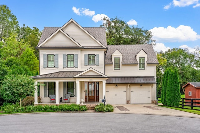 view of front of house with a porch and a garage