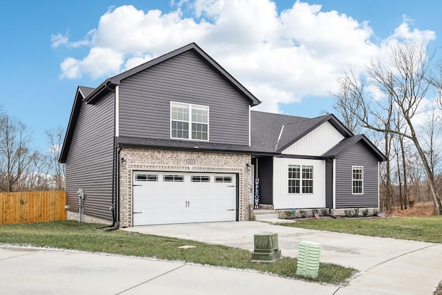 view of front of home featuring a garage and a front lawn