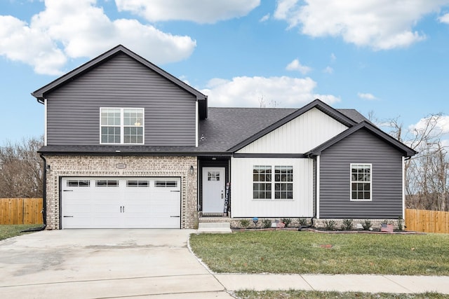 view of front facade with a front yard and a garage